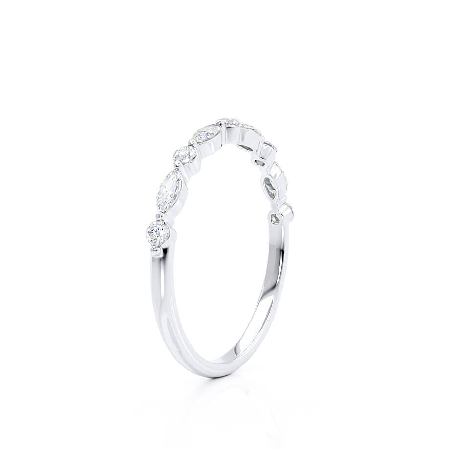 Side angle of slim arc-shaped ring in white gold, dainty silhouette with clean curves.
