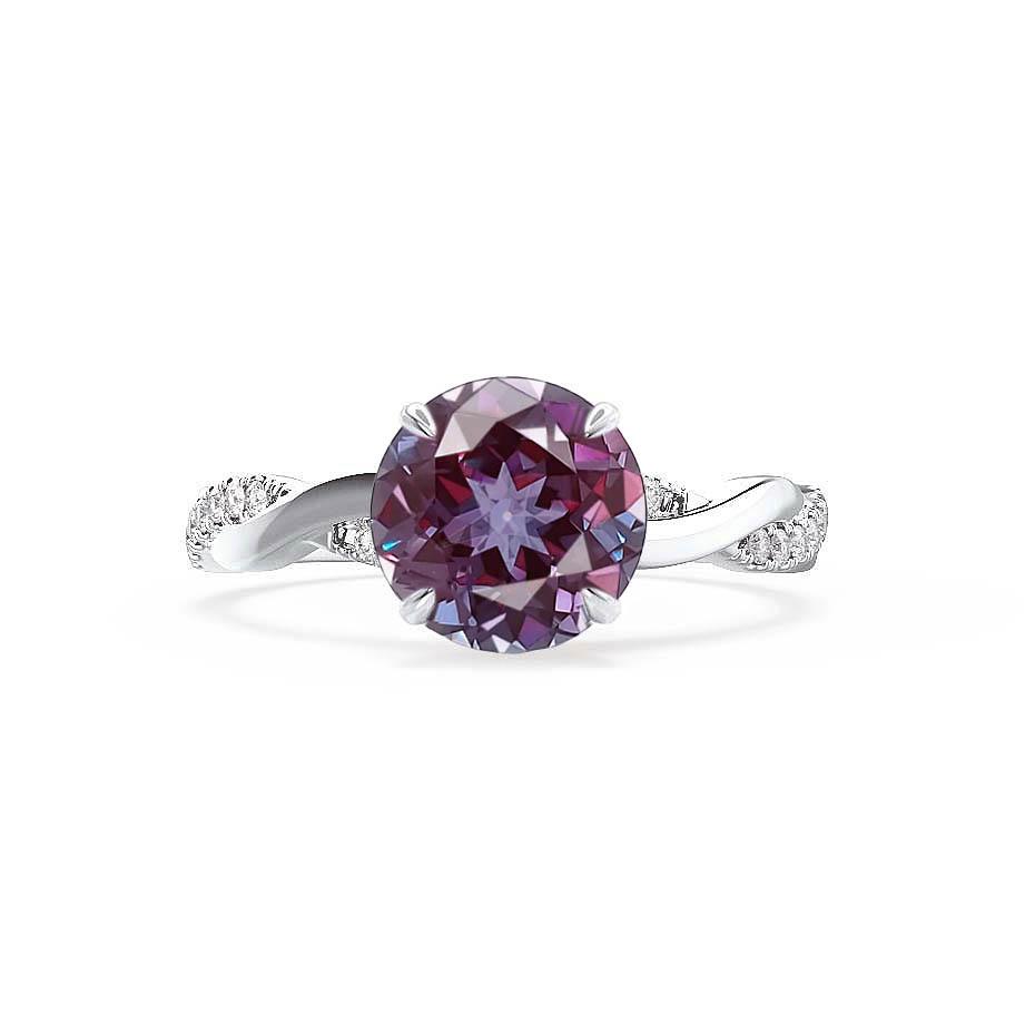 Angled perspective capturing the interplay of light on the color-changing Alexandrite and the vine-like pavé detailing.