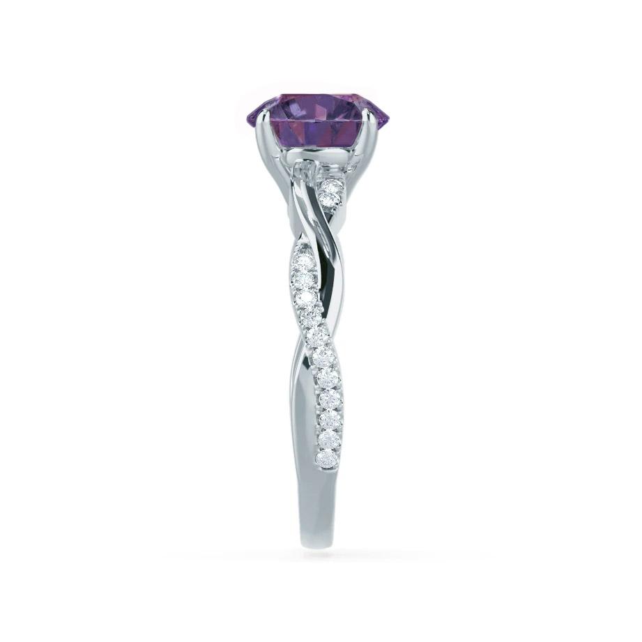 Side profile revealing the artistic curve of the diamond vine and the elevated Alexandrite centerpiece.