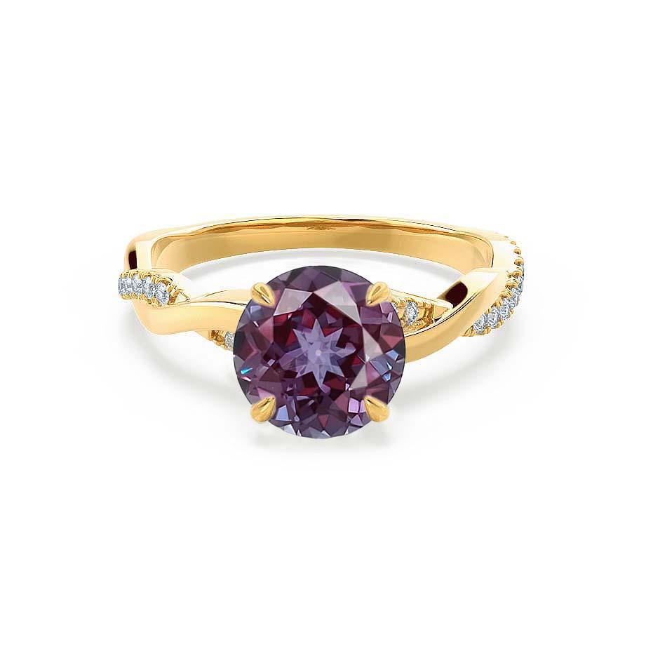 Front view of the Wisteria ring in 18K yellow gold, featuring the glowing round lab-grown Alexandrite as the centerpiece.