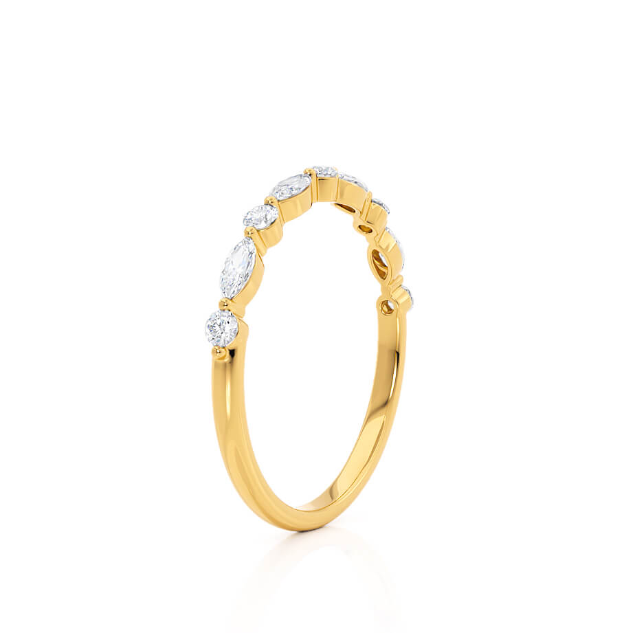 Bezel-set diamond band in yellow gold, featuring alternating round stones and gold beading.