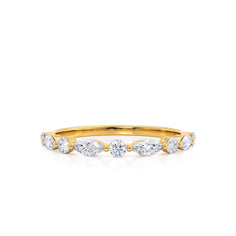 Minimalist yellow gold band with scattered marquise and round diamonds in a twist layout.